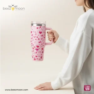A person holding the large-capacity 1300ml pink "Blush Heart" tumbler, showcasing its "Big Size" and ergonomic handle design.