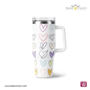 Professional product shot of a Beezmoon white insulated tumbler with multi-colored hand-drawn heart doodles, featuring a white ergonomic handle and clear lid (Code 130).