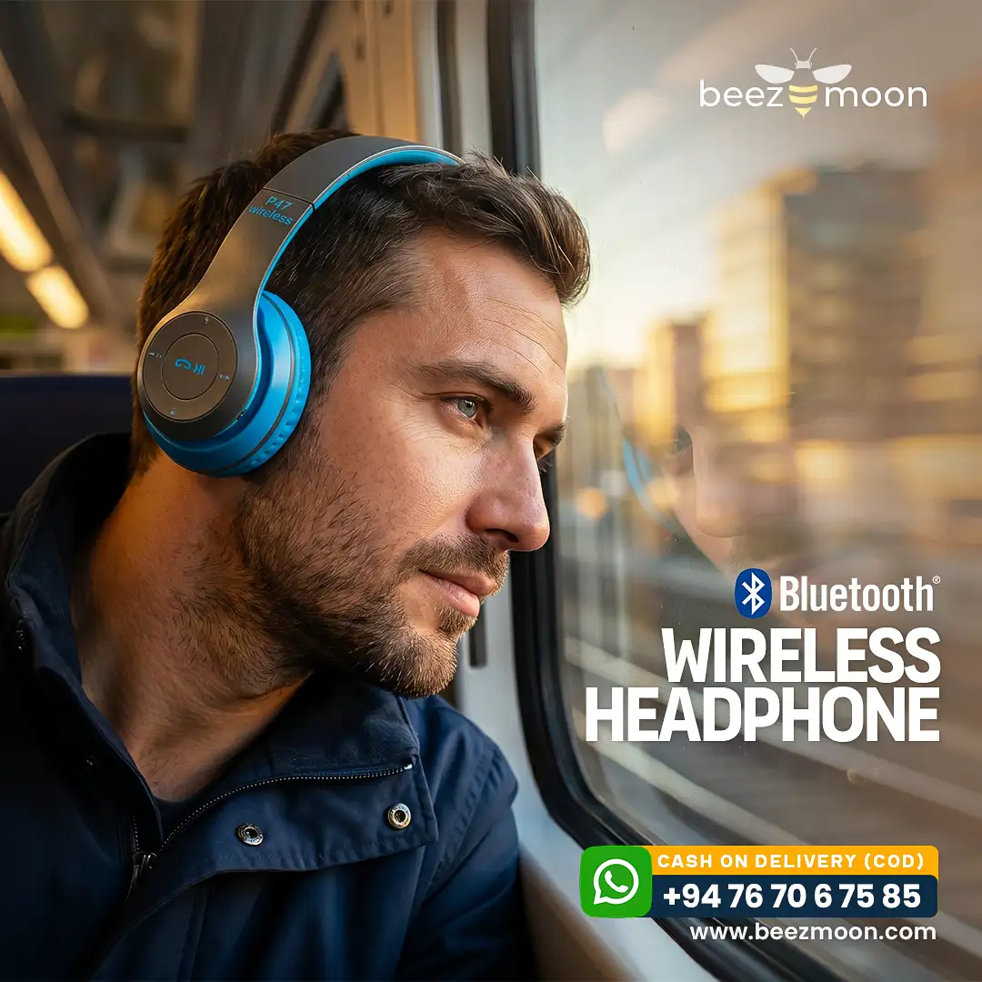 Man traveling on a train wearing blue P47 Bluetooth wireless headphones